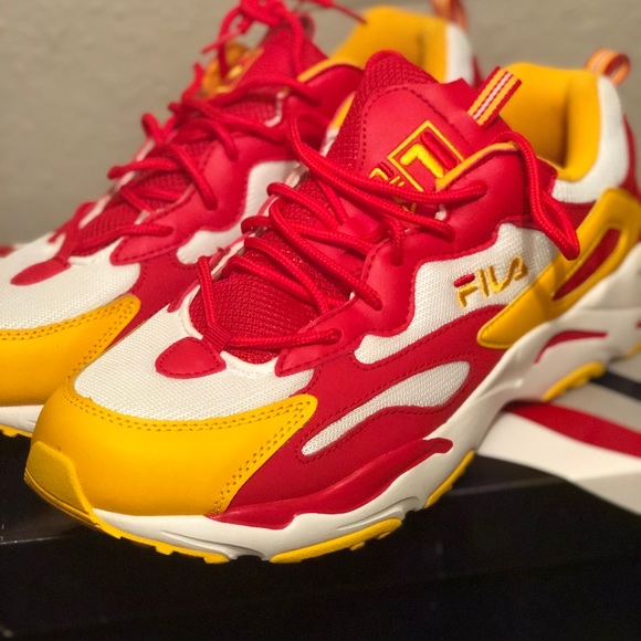 red and yellow fila shoes